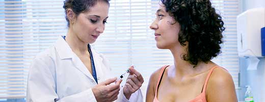 Clinician about to give a patient an injection